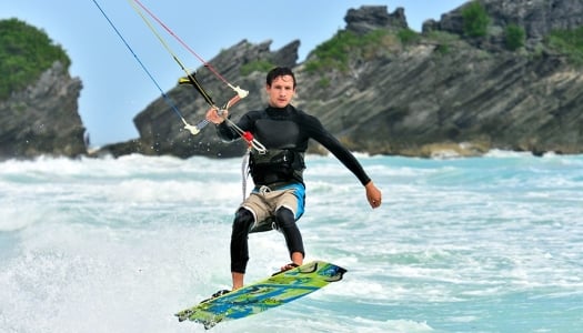 Kite surfer catching a wave