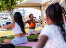 A group is doing yoga during Vegan Fest