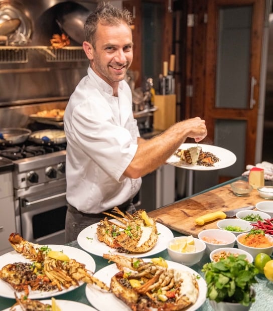 A chef is tabling food.