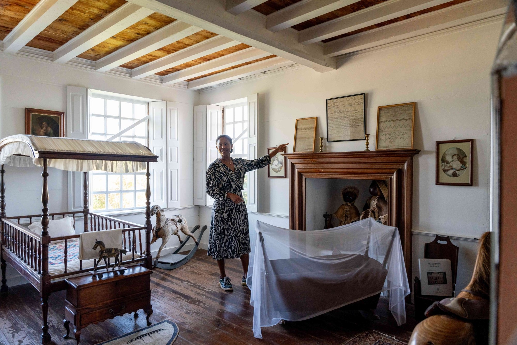 A woman is pointing to items in the Verdmont Museum